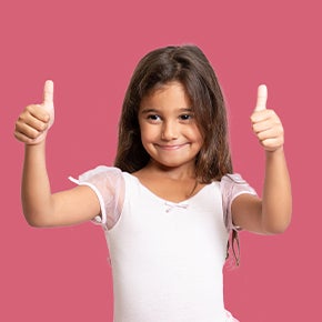 little girl with thumbs up and pink background