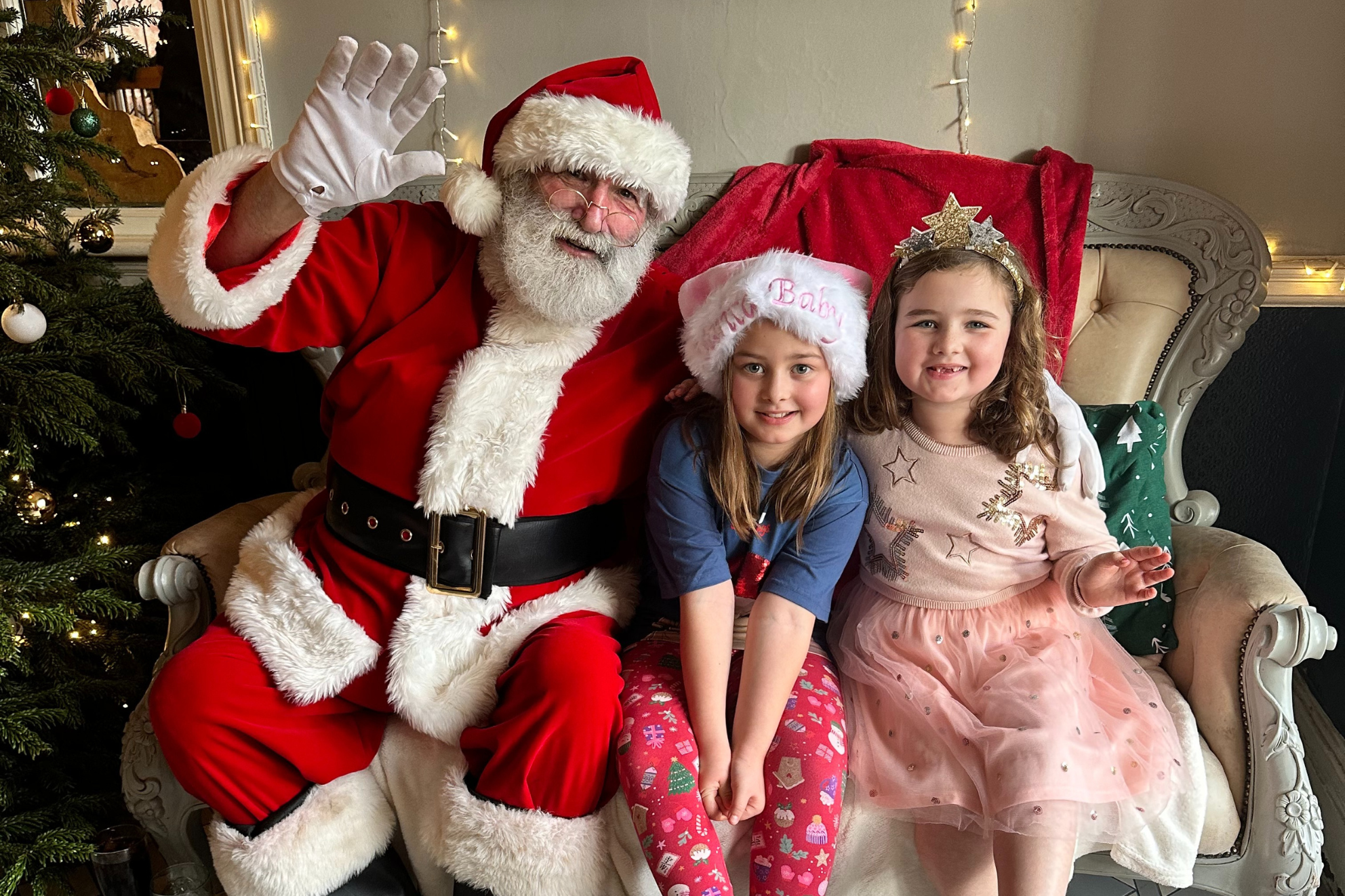 Children sitting with Santa Children sitting with Santa