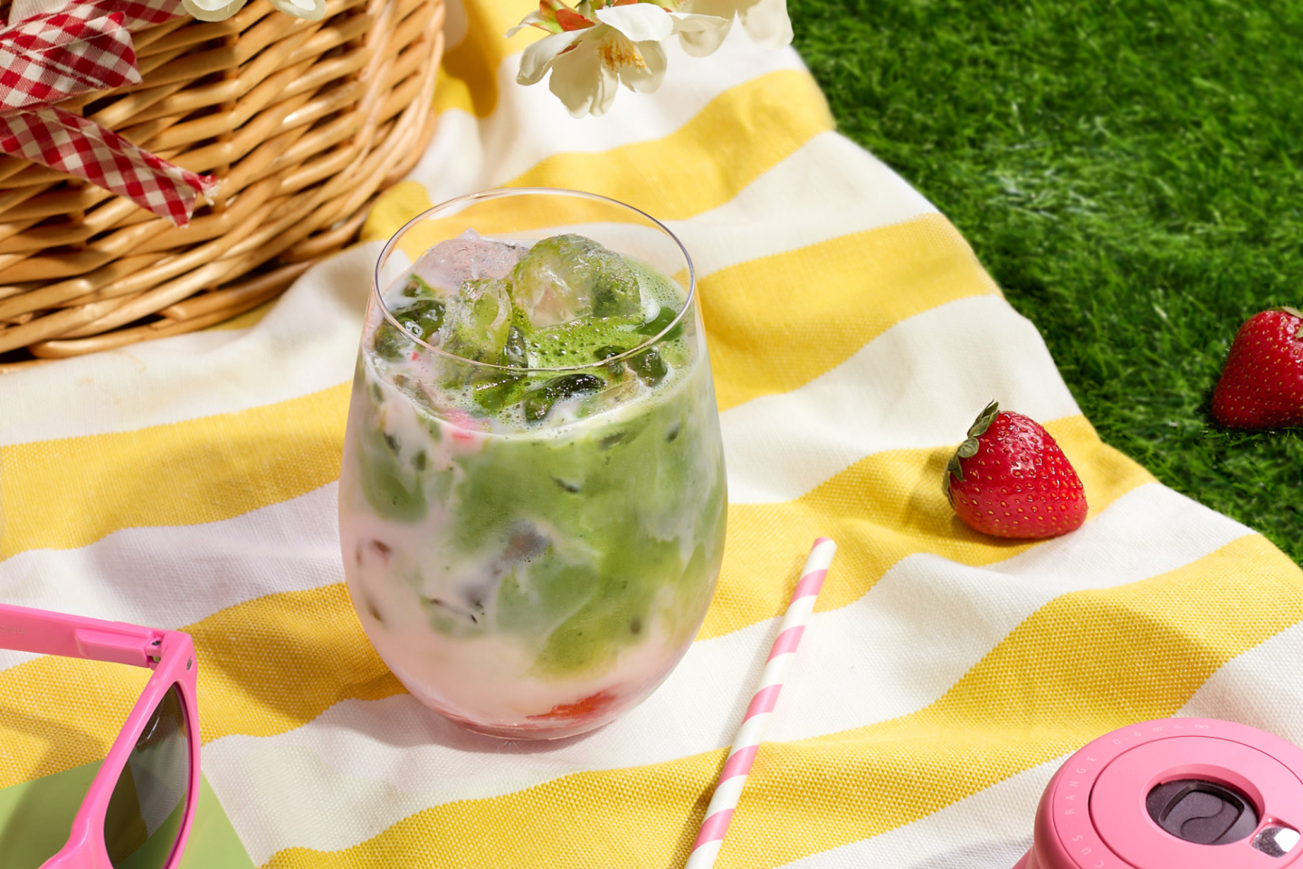 Iced Strawberry Matcha on picnic blanket Iced Strawberry Matcha on picnic blanket