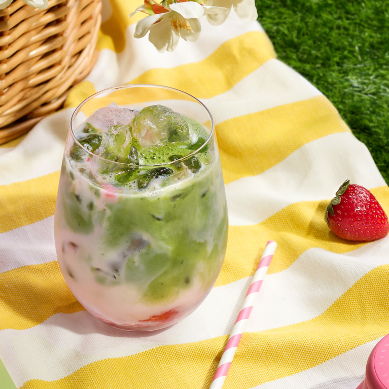 Iced Strawberry Matcha on picnic blanket Iced Strawberry Matcha on picnic blanket